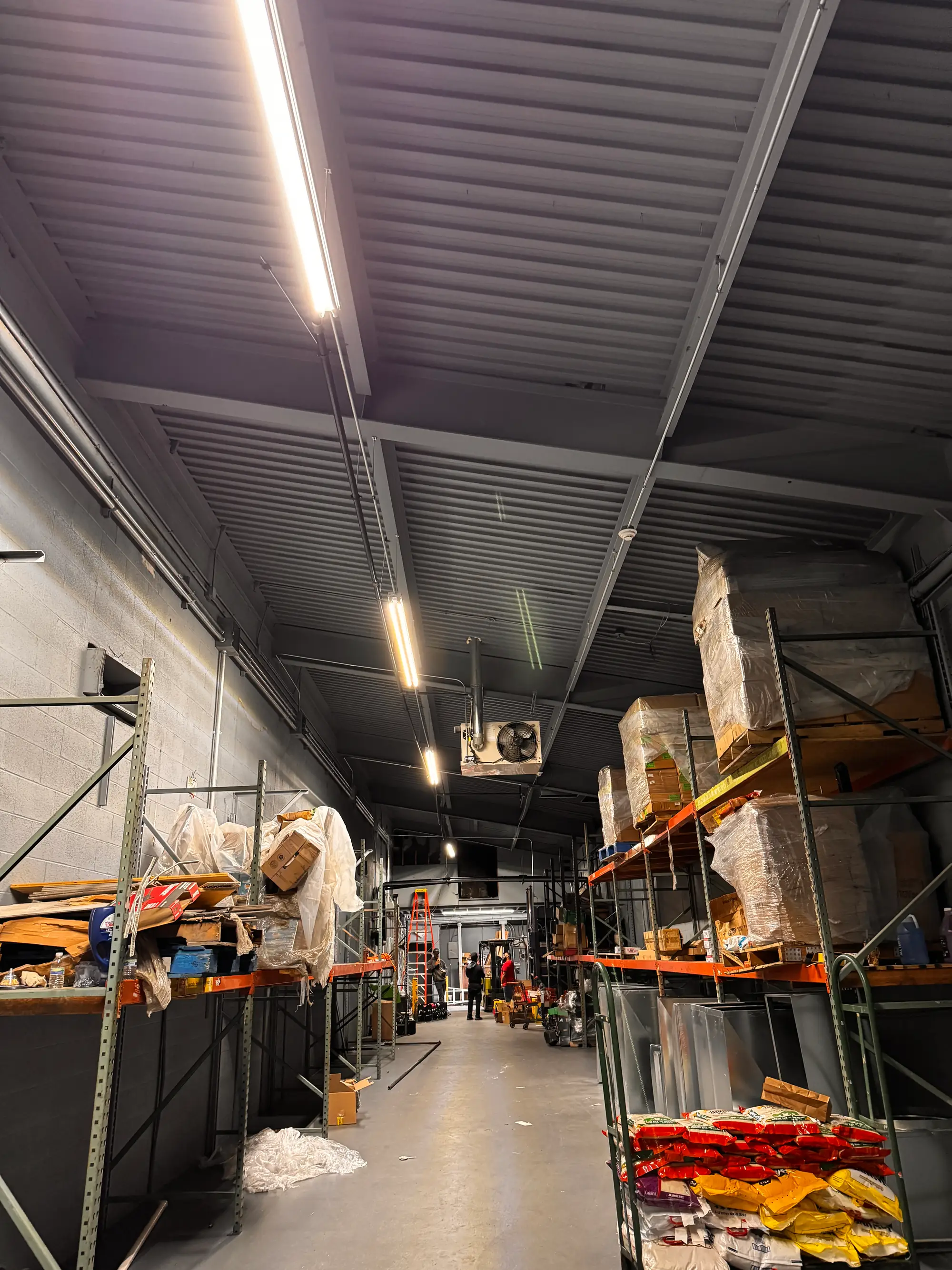 Clean, restocked commercial warehouse after water damage restoration was finished